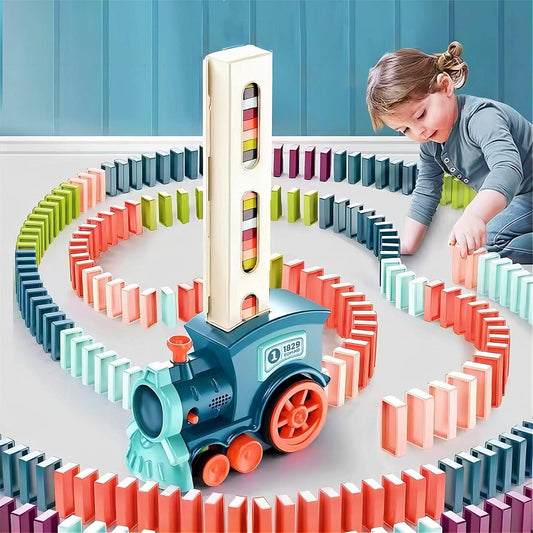 Child playing with a colorful train-themed domino set on a table.