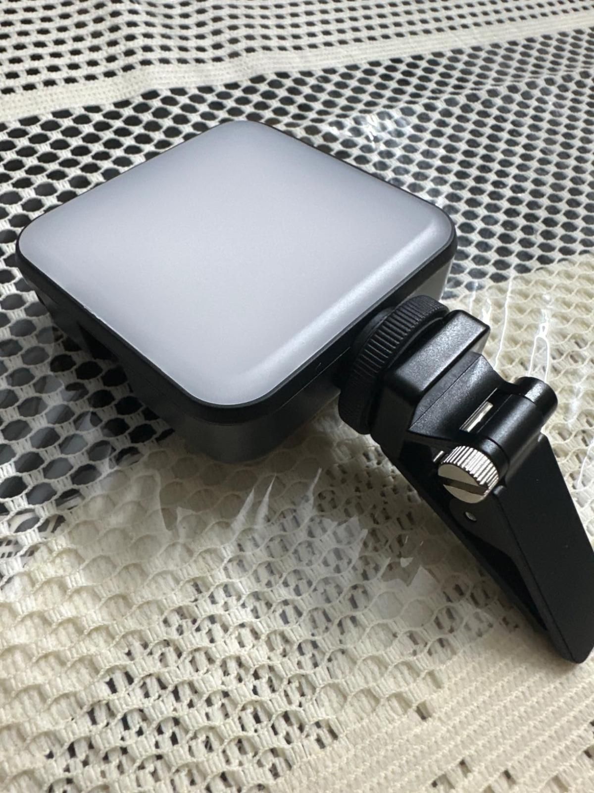 LED Video Light
 with a clamp on a textured surface