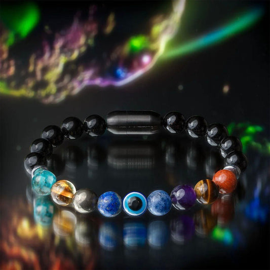 Super 9 Chakra Healing Bracelet on a reflective surface with a cosmic background